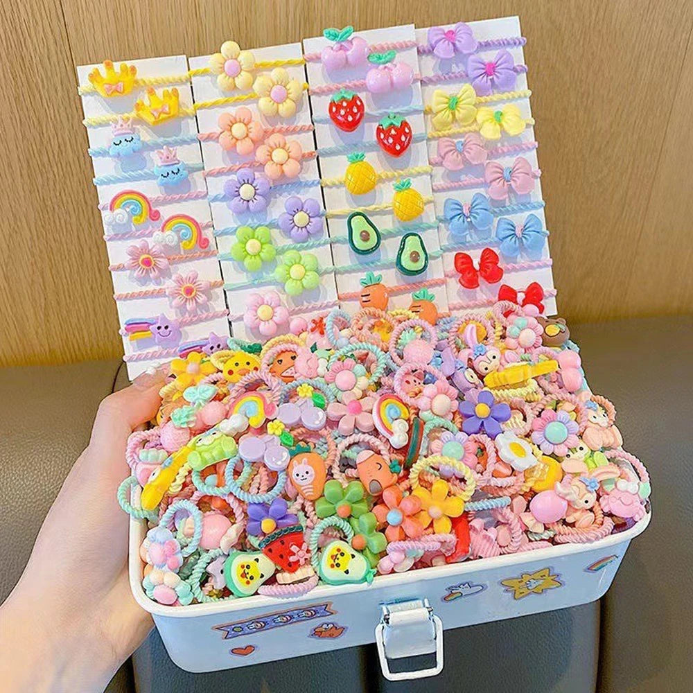 A box of colorful elastic hair ties featuring cute cartoon characters and floral patterns.