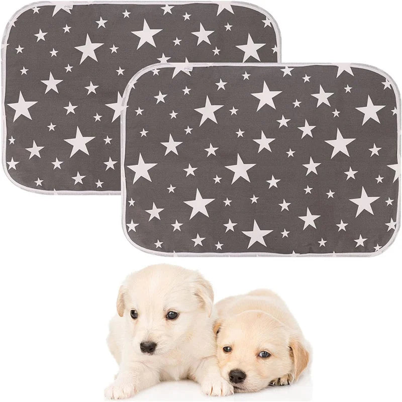 A pair of reusable washable pet training pads with a star pattern and two light-colored puppies.
