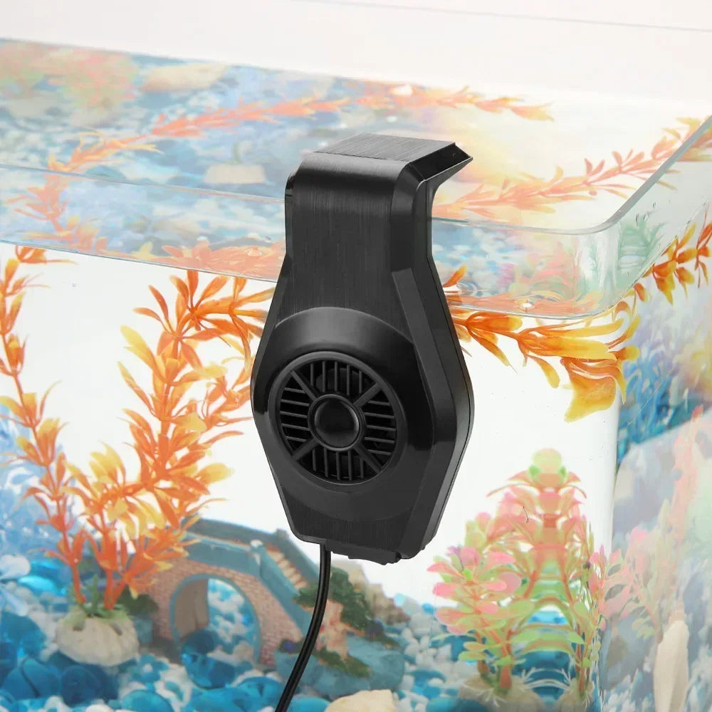 A black USB aquarium cooling fan is shown mounted on a decorated aquarium background.