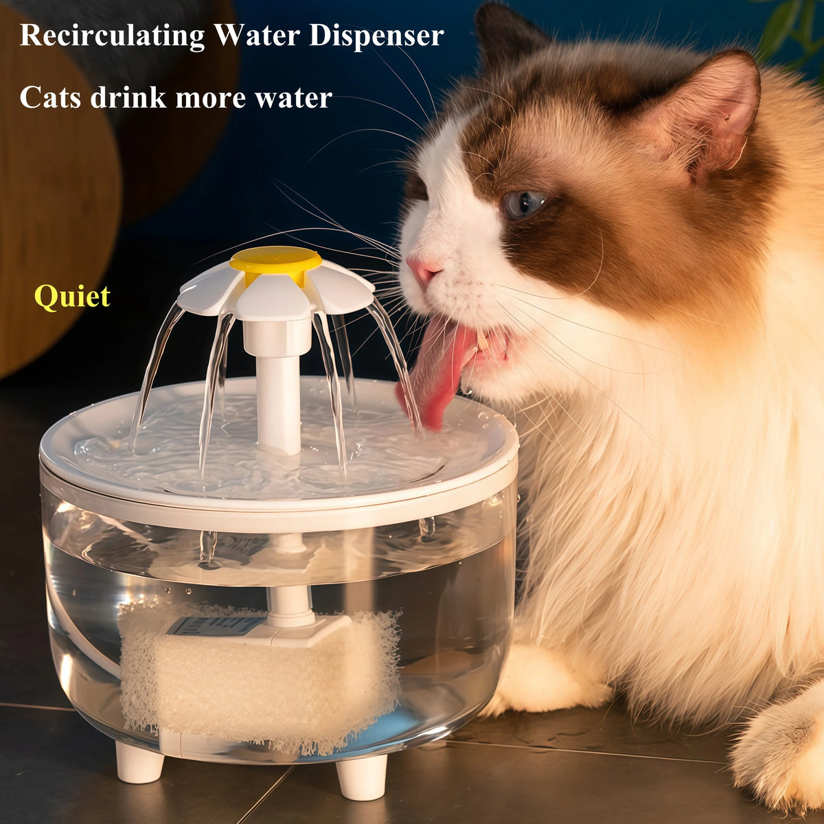 A fluffy cat drinks water from a clear automatic cat water fountain with a filter.