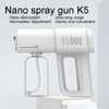 A white Nano spray gun K5 device with a clear bottle is shown on a white surface.
