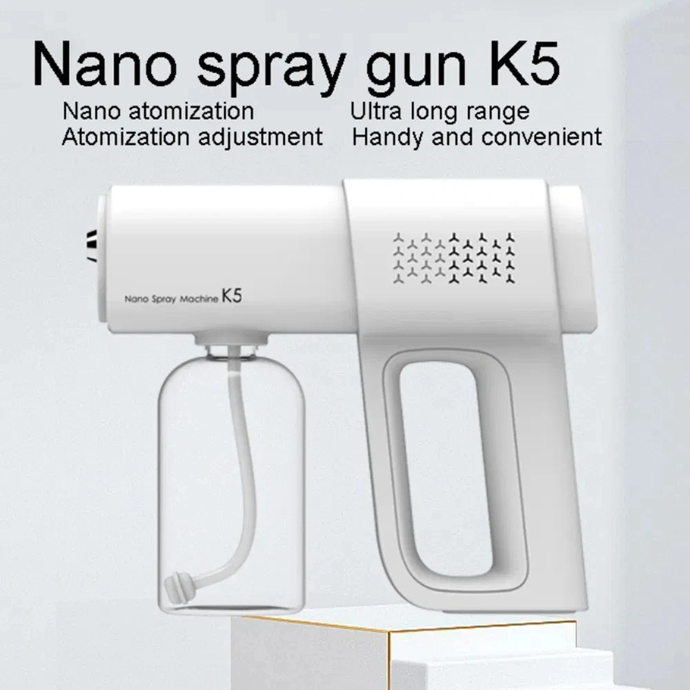 A white Nano spray gun K5 device with a clear bottle is shown on a white surface.