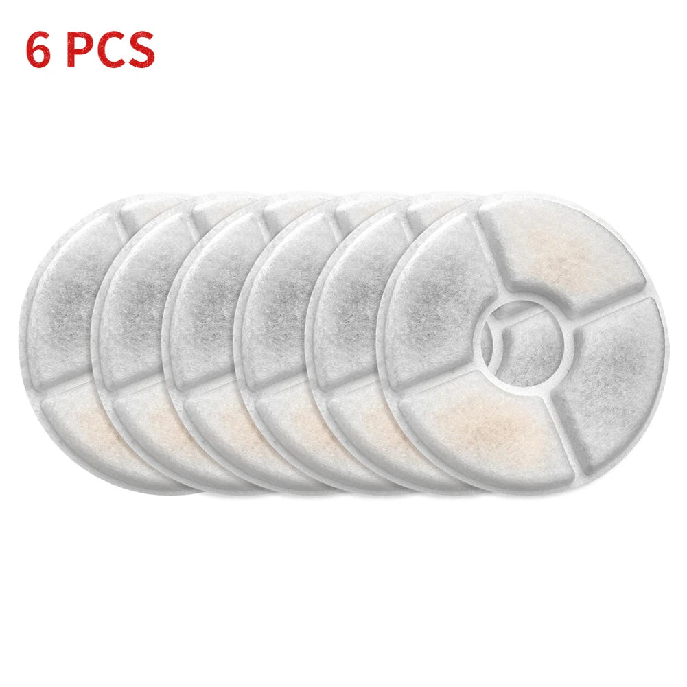 Six replacement filters for pet water fountains stacked in a row.