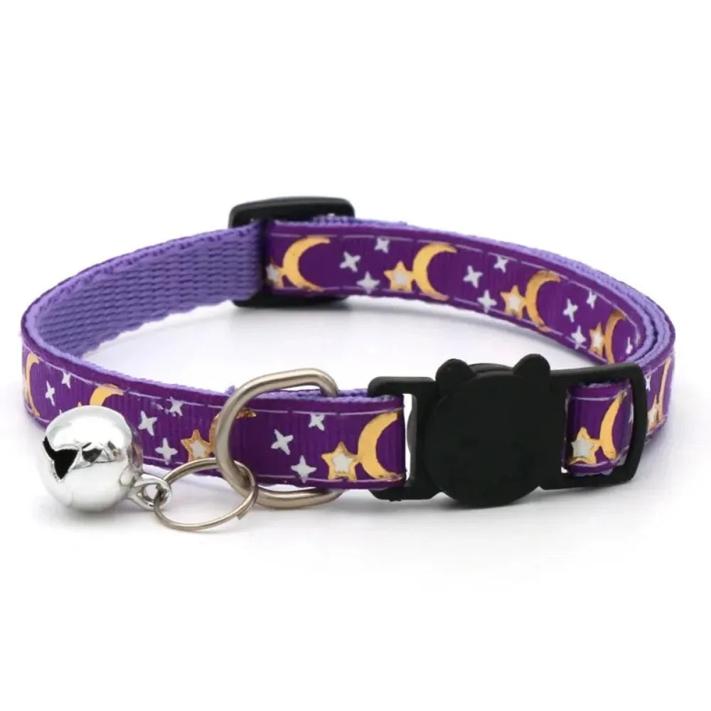 Purple collar with stars and moons featuring a black cat charm and silver bell.