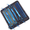 A set of professional stainless steel pet grooming scissors and combs stored in a black case.