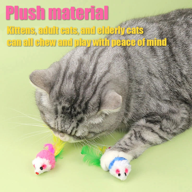 A gray cat is playing with an interactive plush mouse toy that has a feather tail.