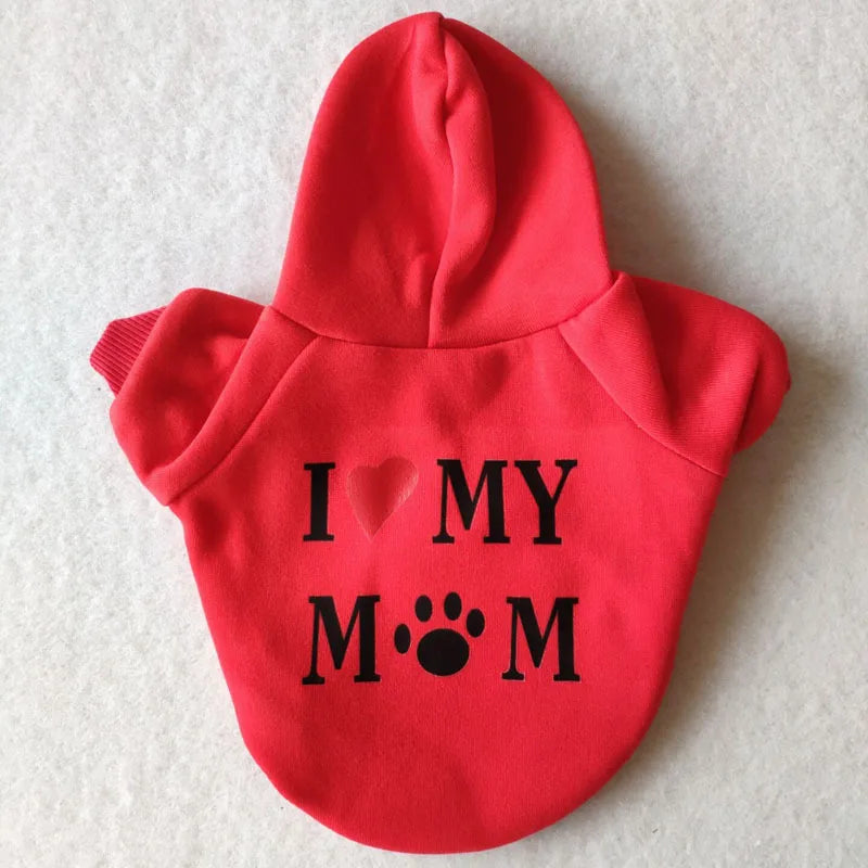 A bright red hoodie featuring black text that reads I love my mom and a paw print.