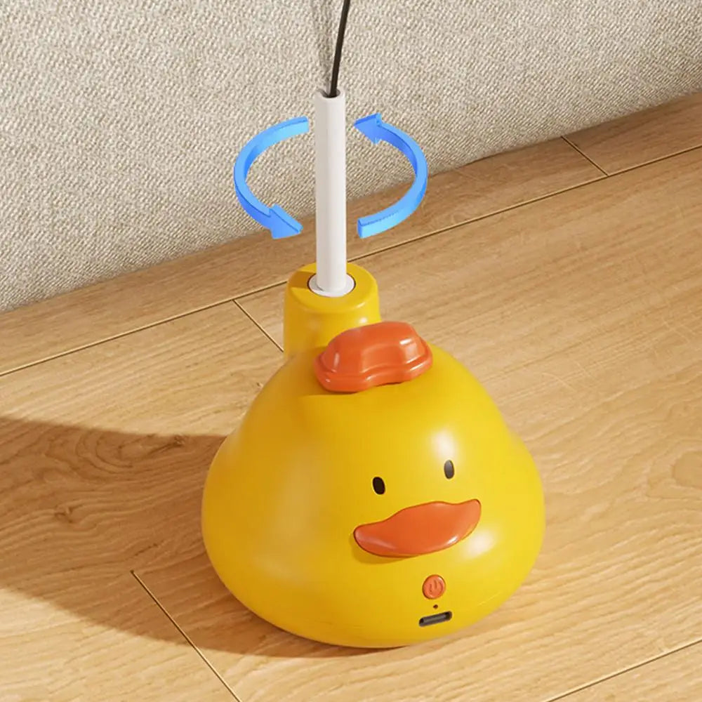 A yellow, round cat-shaped toy with an orange nose and rotating feather teaser attached to a white stick.