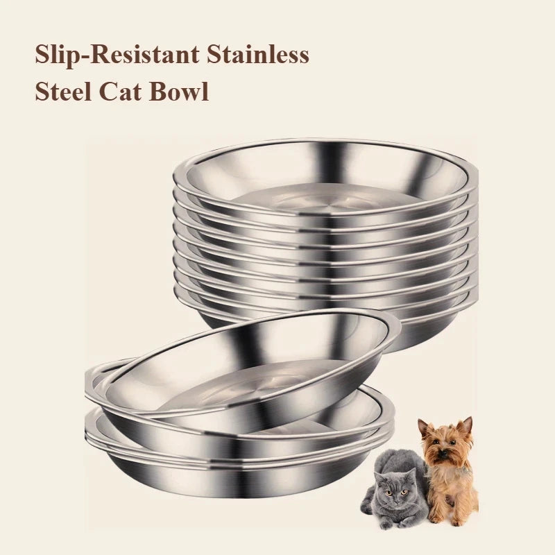 A stack of shiny stainless steel cat bowls with a small kitten and a dog next to them.