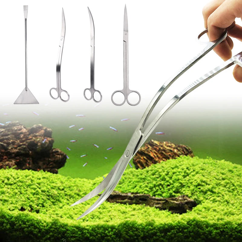 A hand holds a set of stainless steel aquarium cleaning tools, including various types of forceps and scissors, resting on gr