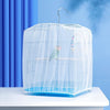 A clear mesh bird cage with a dome top and blue base sits on a white surface.