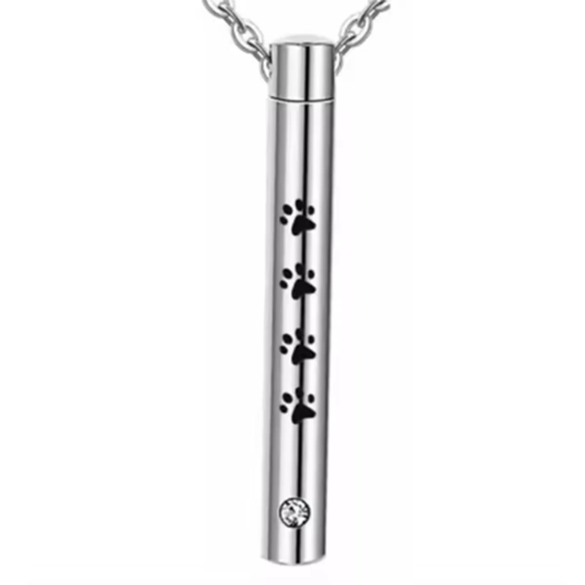 A silver stainless steel pet memorial necklace featuring paw prints and a small gemstone charm.