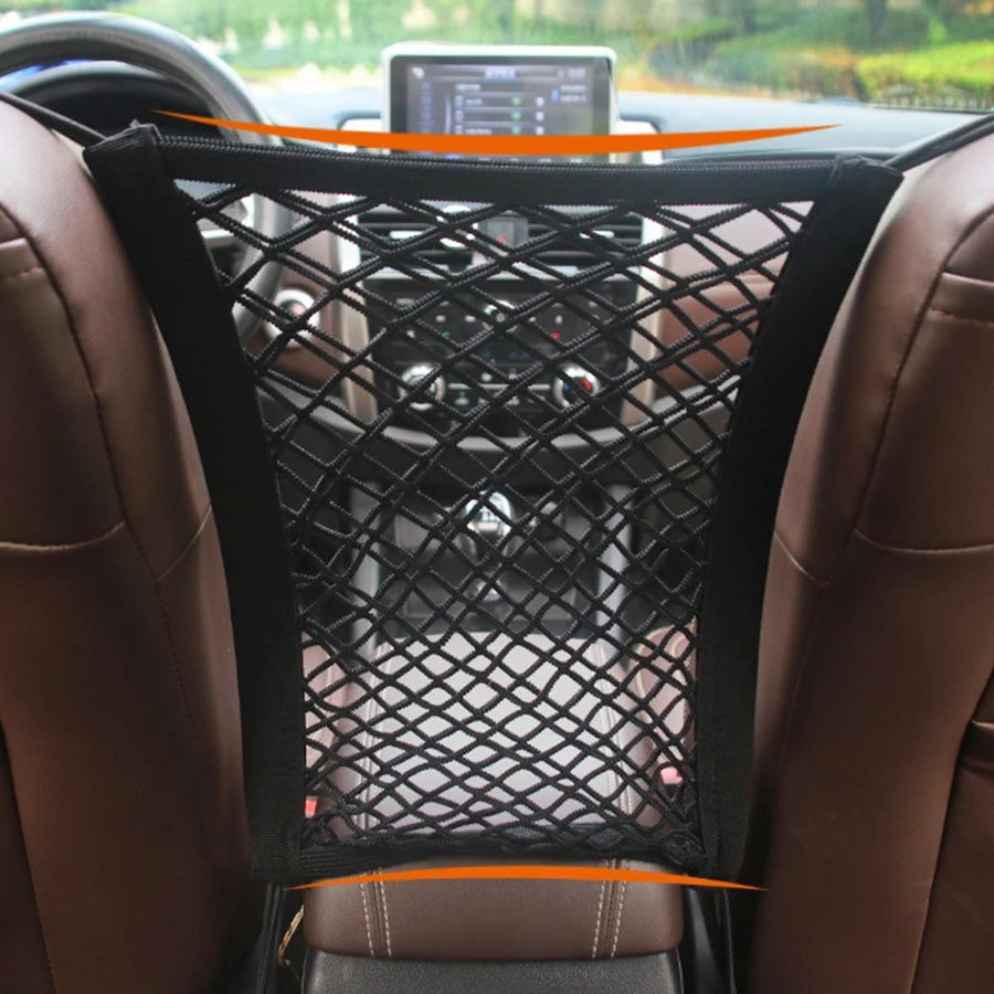 A black mesh dog barrier is installed in a car seat, designed for automatic safety mesh storage.