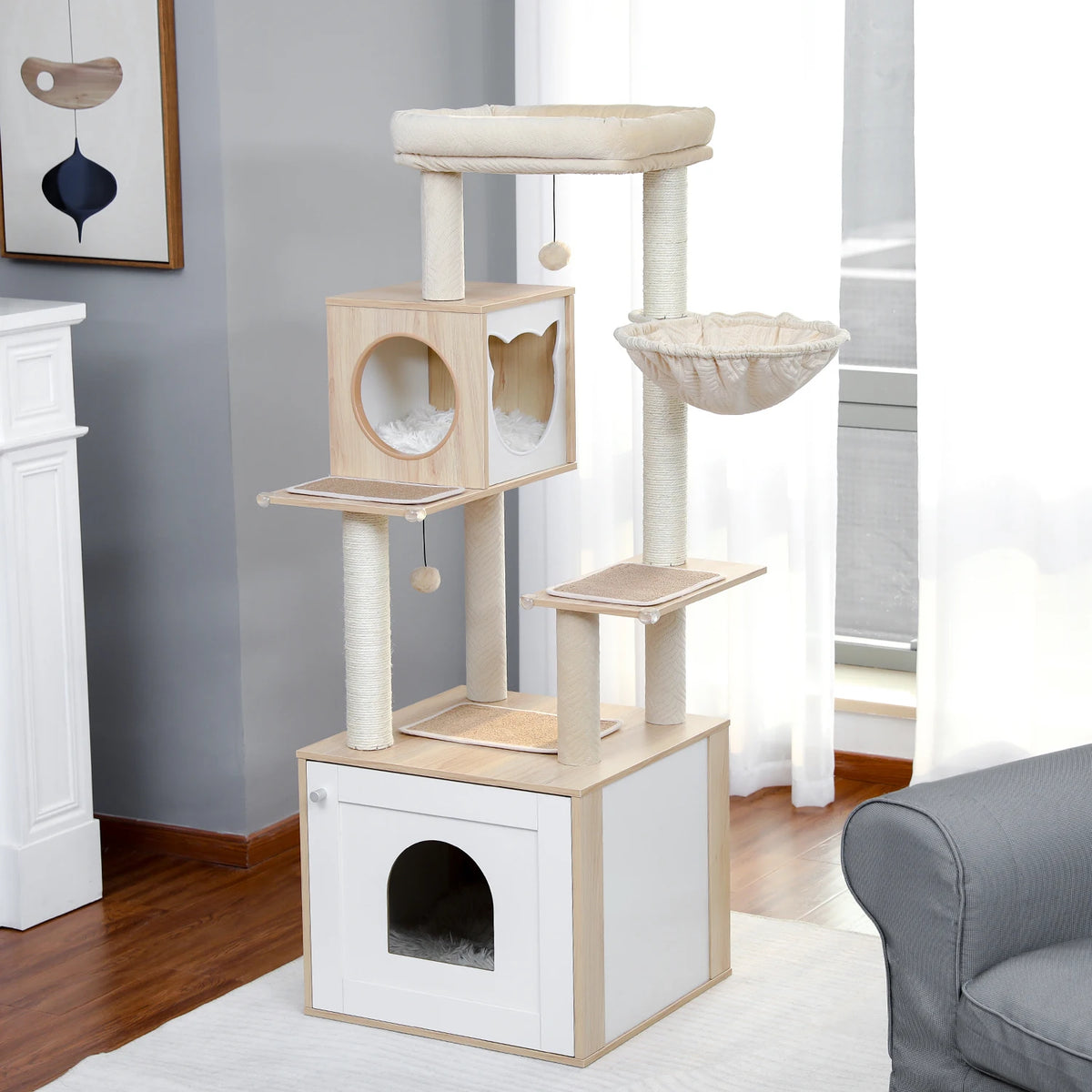 A wooden cat tower with a litter box enclosure and scratching posts is displayed indoors.