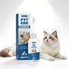 A bottle of Pet Ear Cleaner solution is shown next to a box, with a fluffy cat sitting beside it.