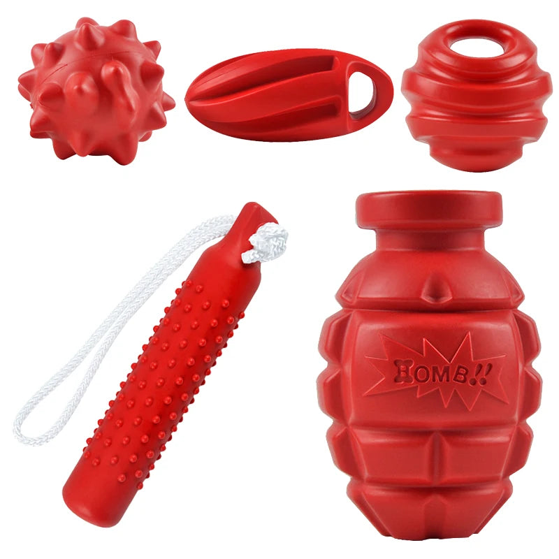 Red durable bite-resistant dog chew toys including a ball, a paddle, and a squeeze bottle.