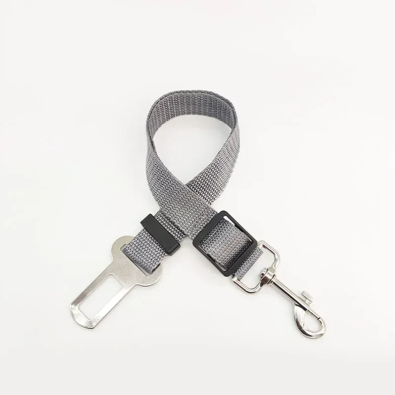 Gray adjustable pet car safety harness with a seat belt clip attached