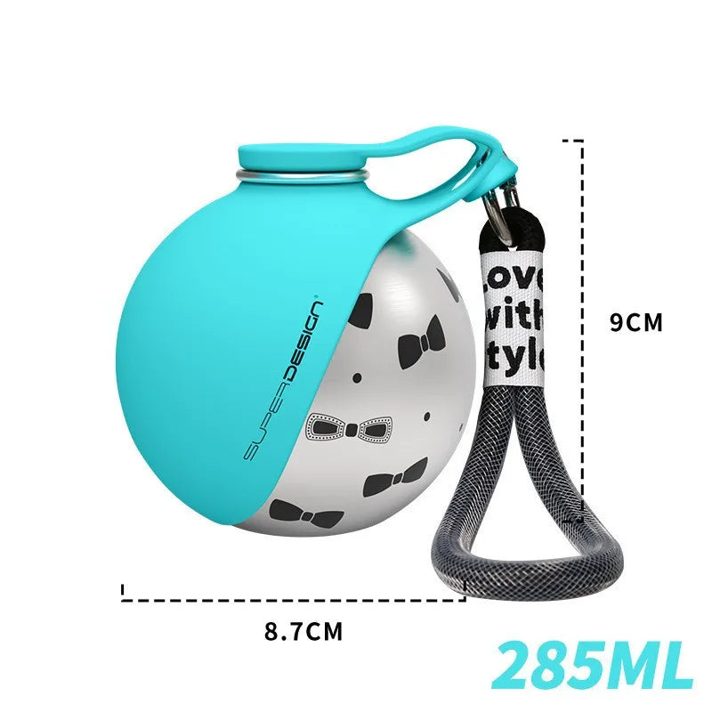 A turquoise portable stainless steel dog water dispenser with a silicone spout and a black fabric strap.