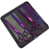 A purple and silver professional stainless steel pet grooming scissors set stored in a black zippered case.