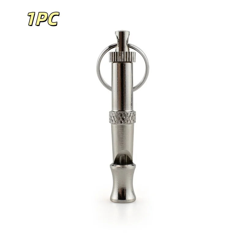 A stainless steel adjustable ultrasonic dog training whistle with a metal loop and cylindrical body.