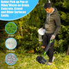 A man is using a heavy duty pet poop scooper with a long handle to pick up waste from grass, concrete, gravel, and other surf