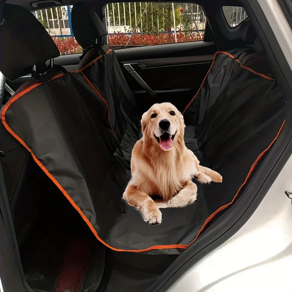 A golden retriever sits inside a black waterproof dog car seat hammock cover in a car interior.