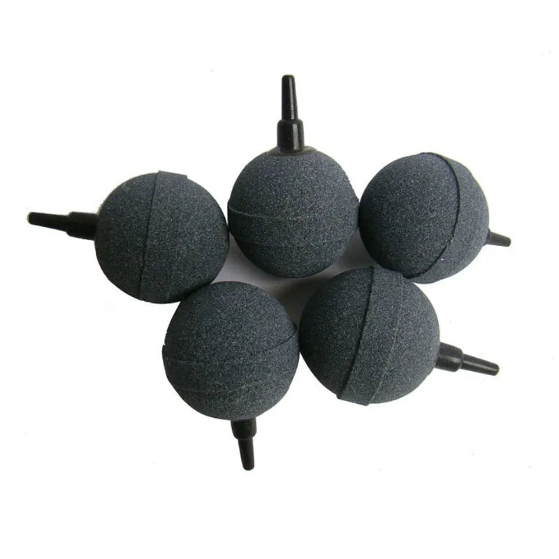 A set of black aquarium air stones with fine bubble oxygen diffusers.