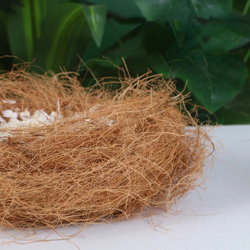 A pile of natural brown coconut fiber bird bedding material.