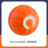 Orange pet jump ball for dogs and cats with ridges and a glowing light feature