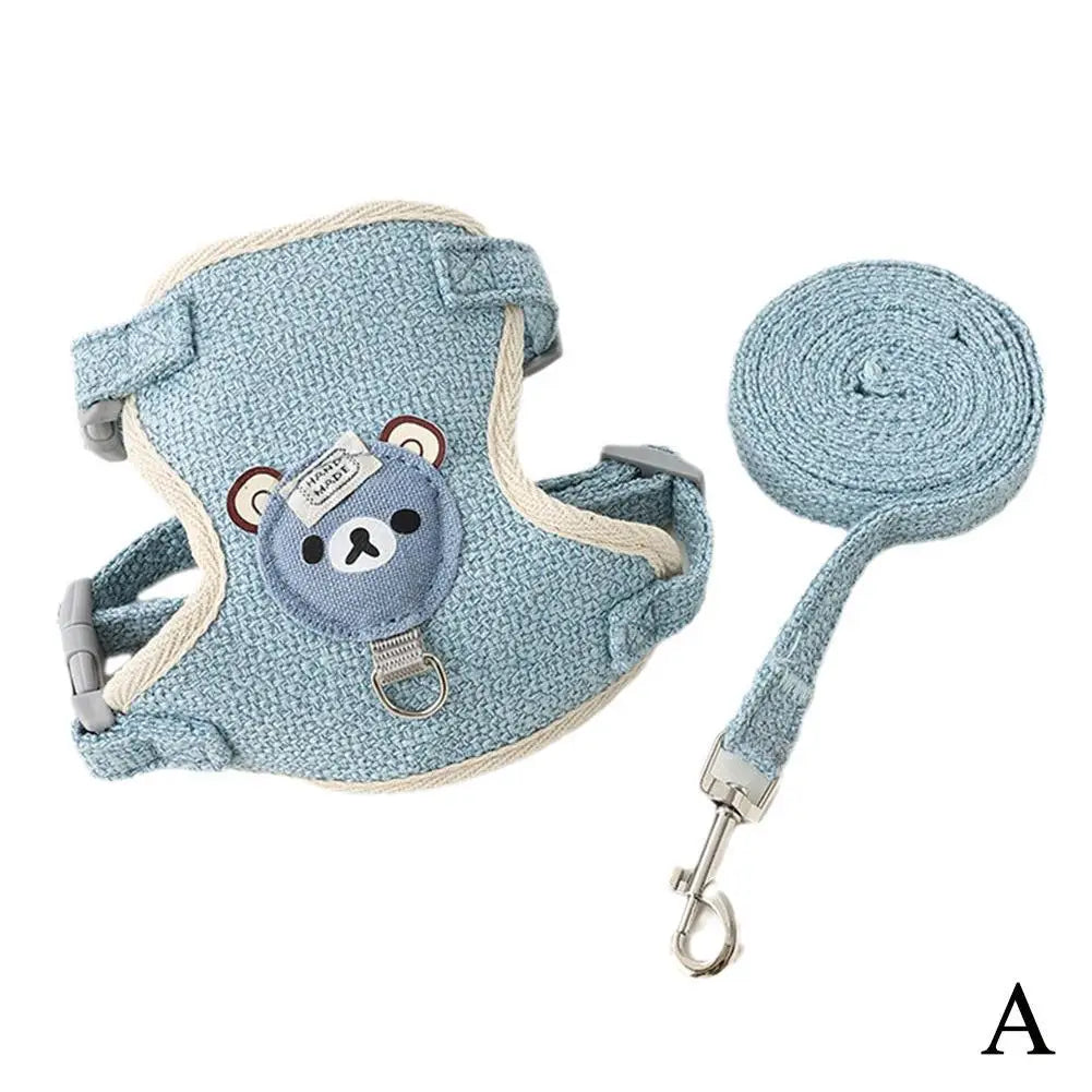 A light blue pet leash harness for dogs and cats with a handle and clip.