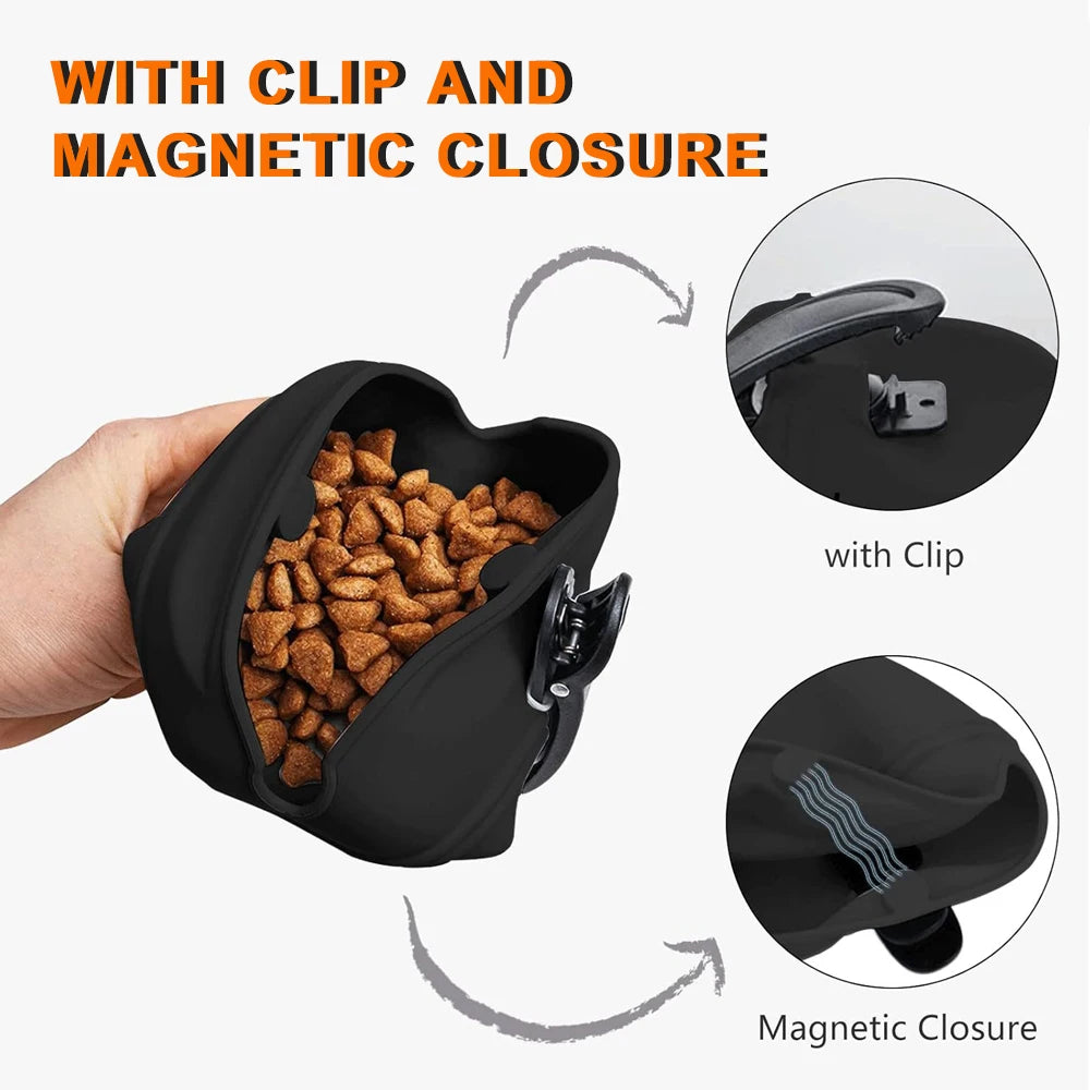 Black silicone dog treat pouch shown with a hand, demonstrating the clip and magnetic closure features.