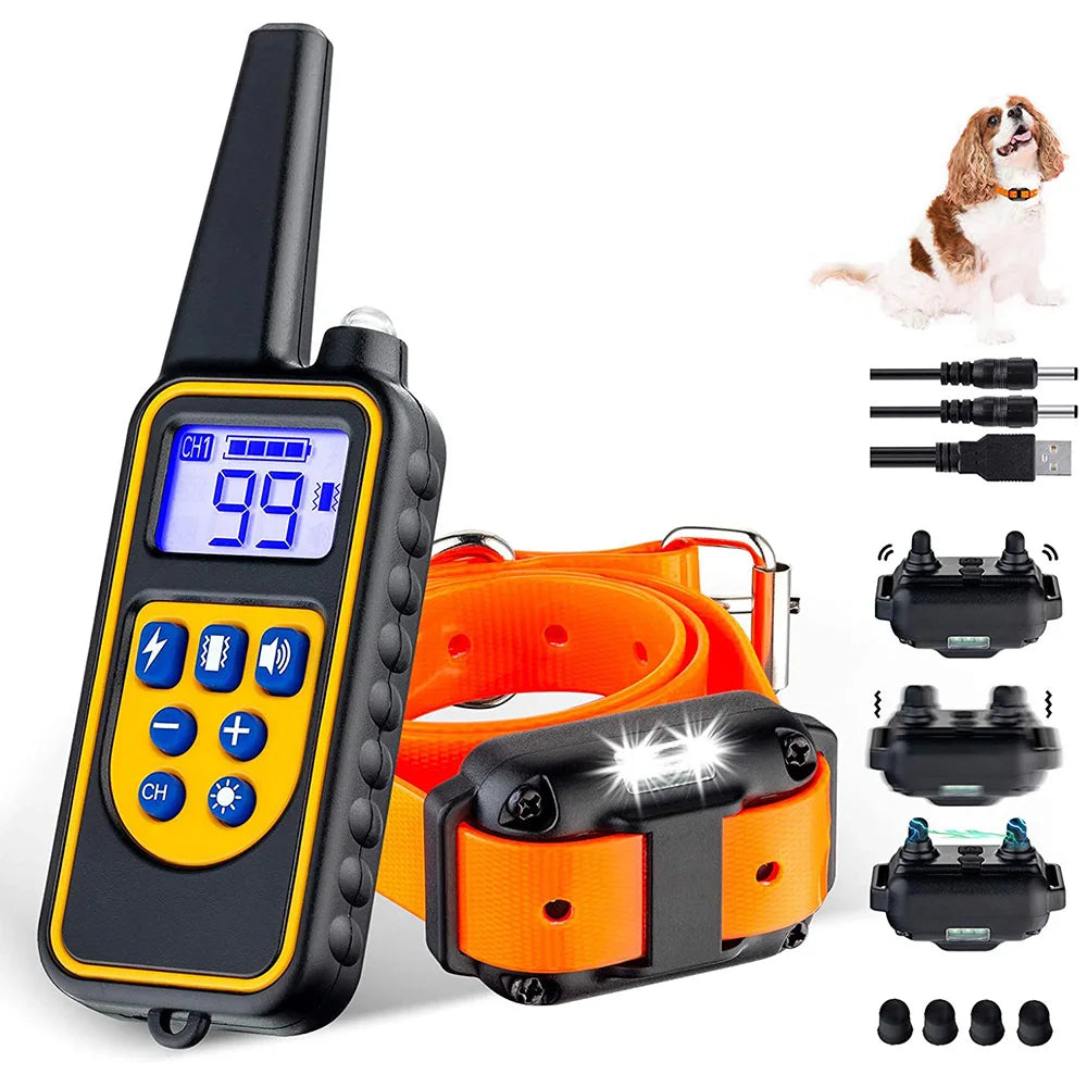 A black remote control dog training collar with various accessories and a small dog.