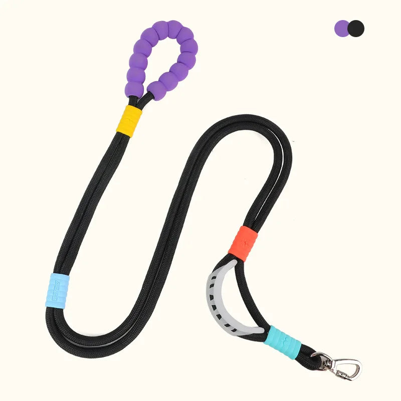 Black adjustable hands-free dog leash with purple handle and orange clip.