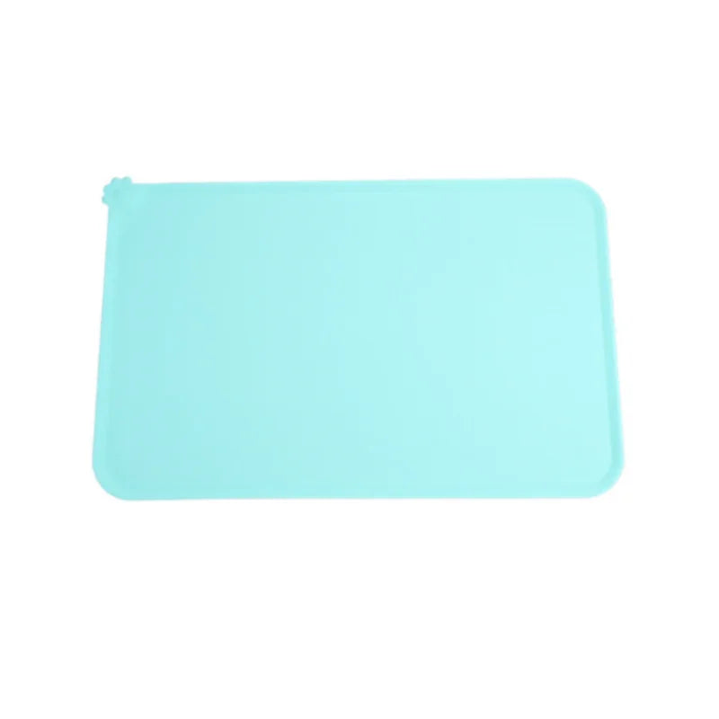 A light blue waterproof silicone pet feeding mat.