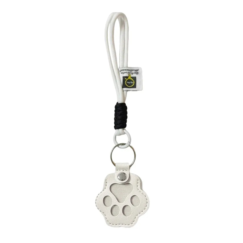 White refillable pet hair keychain with a cat paw charm