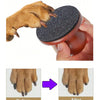 A hand holds a wooden-handle dog nail file with reusable sandpaper pads, showing before and after results on a paw.