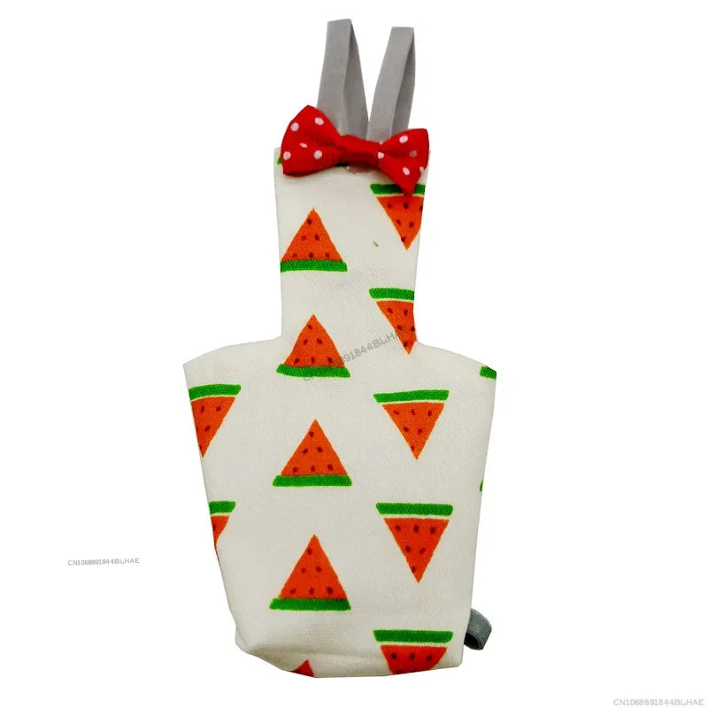 A white shirt-like garment featuring a repeating pattern of orange and green triangles, tied with a red bow tie.