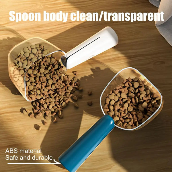 Transparent ABS spoon for measuring pet food, showing dry and wet food scoops on a wooden surface.