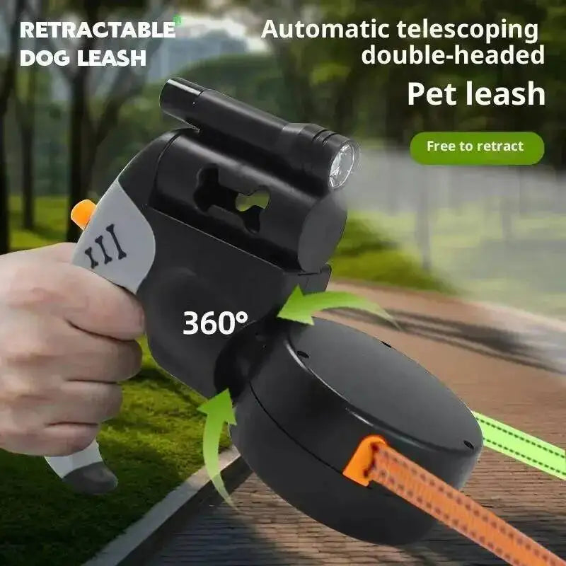 A hand holds a black retractable dog leash with a double-headed design and built-in LED flashlight, showing the 360 degree ar