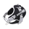 Black and silver reflective dog harness with the text SERVICE DOG printed on the strap