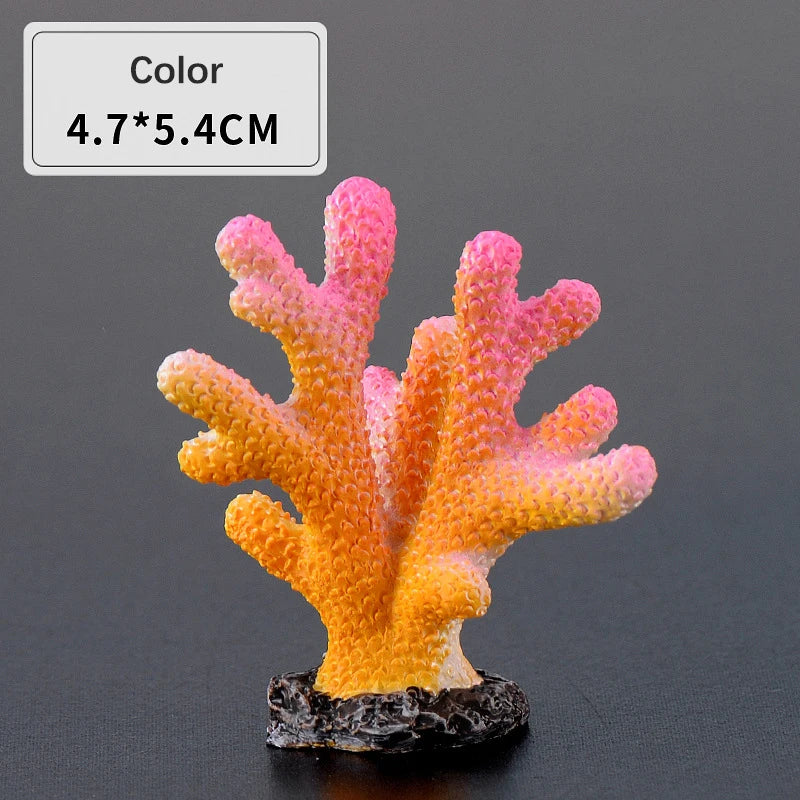 Orange and pink resin coral decoration with a black base