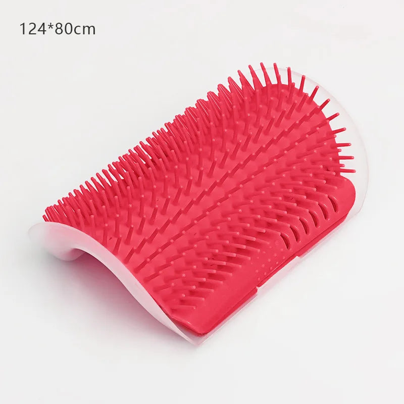 A bright pink silicone massage brush with numerous prongs is shown from above.