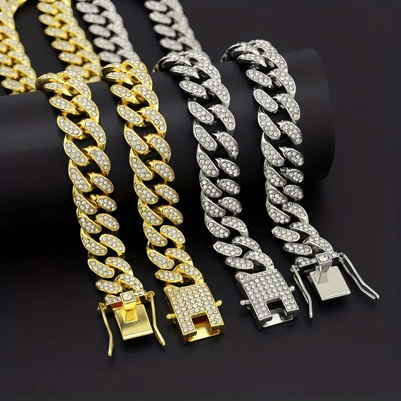 A display of several gold and silver Cuban link rhinestone pet collars with bone charms.
