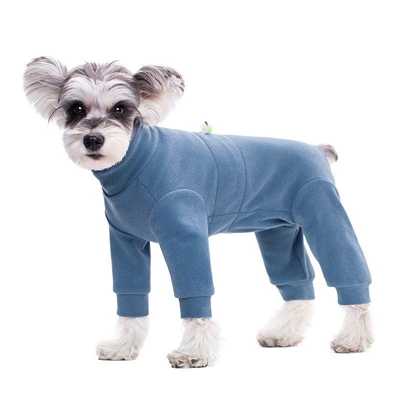 A light blue thermal fleece dog jumpsuit with gray fur standing against a white background.