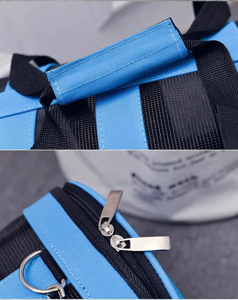 Close-up of a light blue and black mesh travel carrier bag with silver hardware