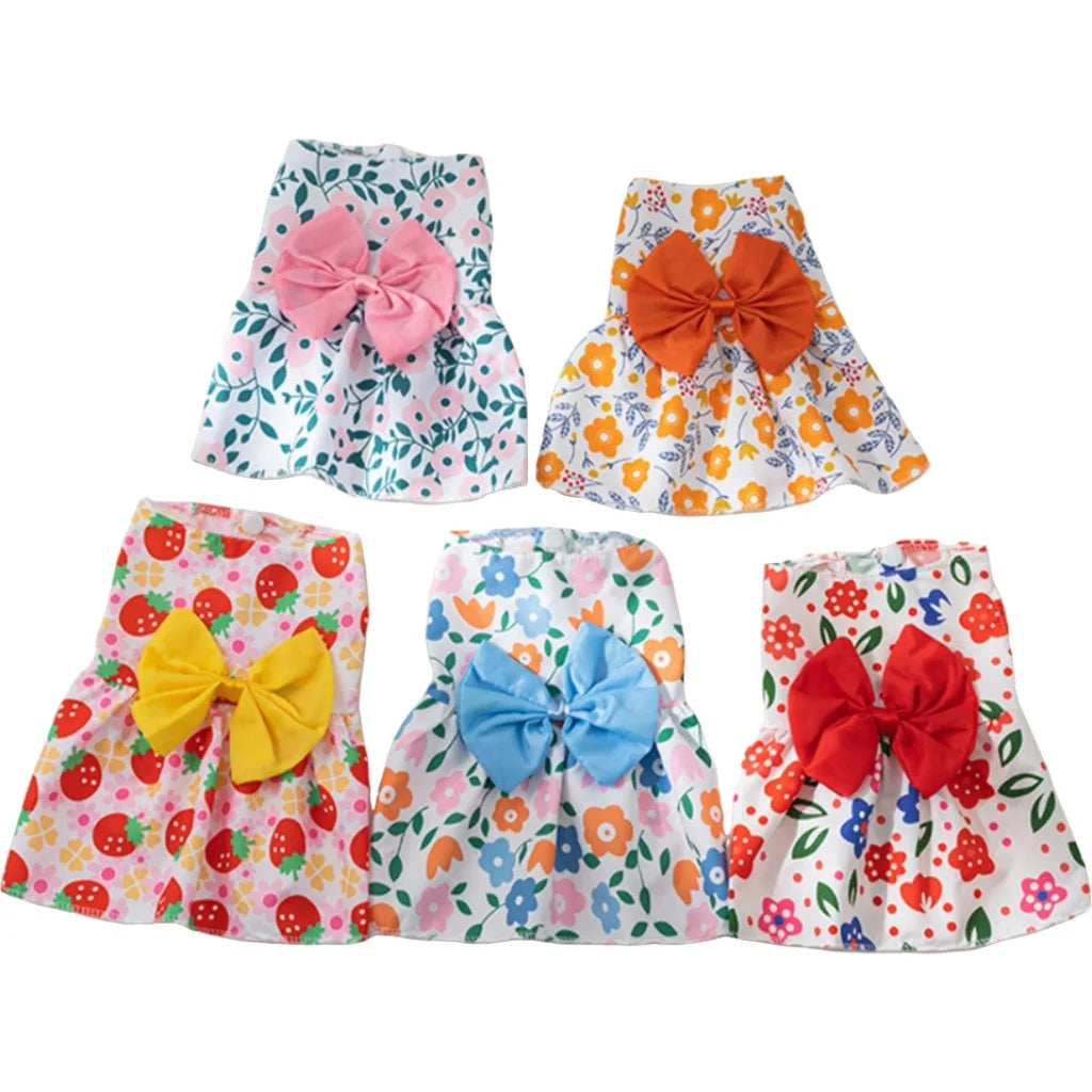 A collection of colorful lace bow pet dresses for small dogs and cats in various floral patterns.