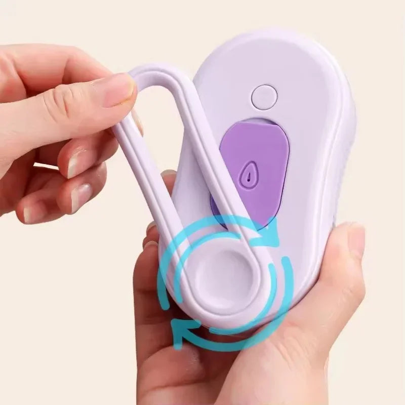 A hand holds a purple 3-in-1 self-cleaning cat grooming brush with soft massage bristles.