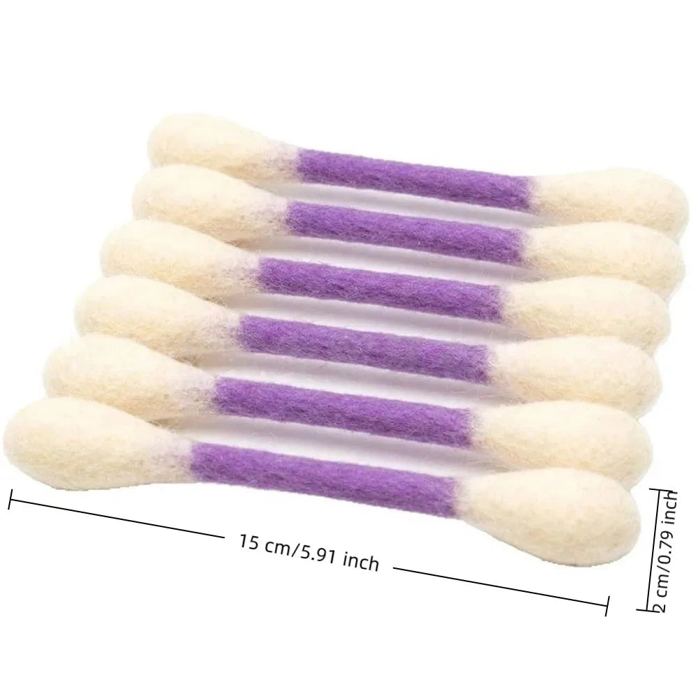 A set of oversized cotton swabs with white tips and purple shafts used as cat toys or for dental care.