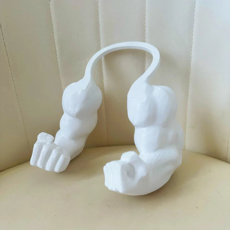 A white 3D printed accessory shaped like a cat muscle arm, displayed against a light background.