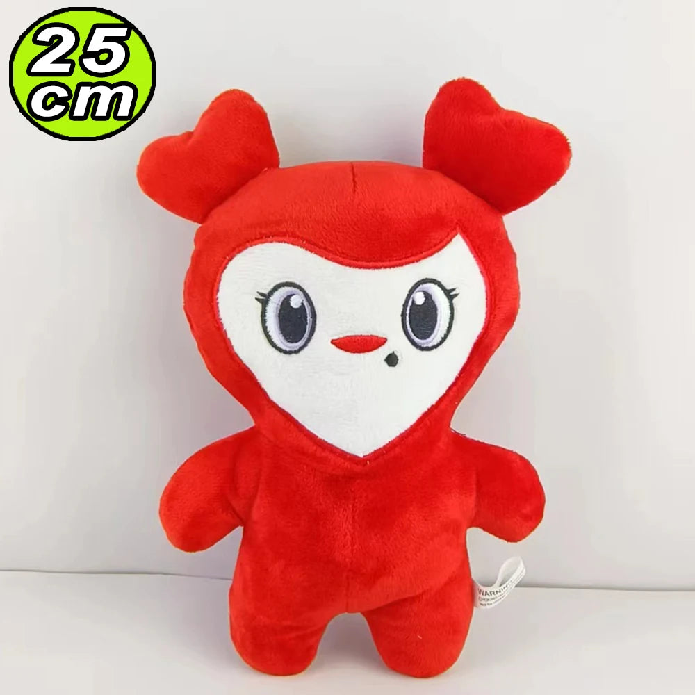 A bright red plush toy resembling a stylized animal character with white facial markings and large ears.